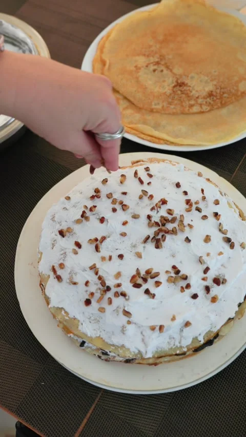 Whipped Cream Crepe Cake Layer with Nuts Stock Footage 320681682