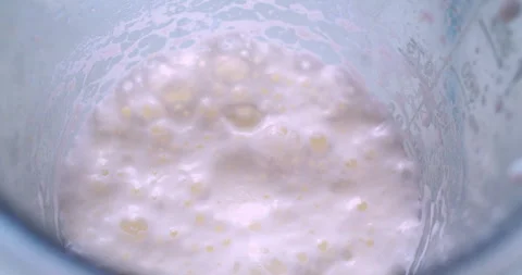 A whipped milkshake in a plastic cup.A close-up shot Stock Footage 333576720