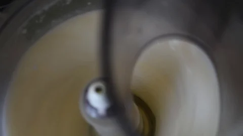 Whipping chicken eggs in a food processor for dough preparation Stock Footage 91081065