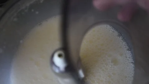 Whipping chicken eggs in a food processor for dough preparation Stock Footage 92234750