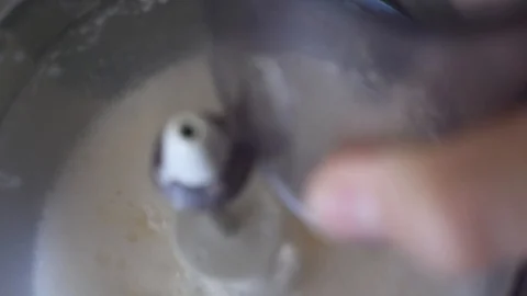Whipping chicken eggs in a food processor for dough preparation Stock Footage 92234998