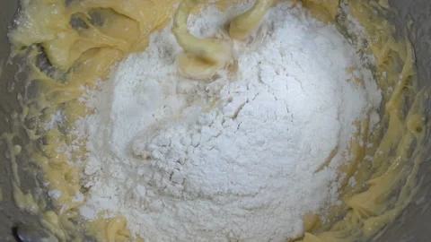 Whipping dough with flour of a food processor in slow motion Video stock 145764812