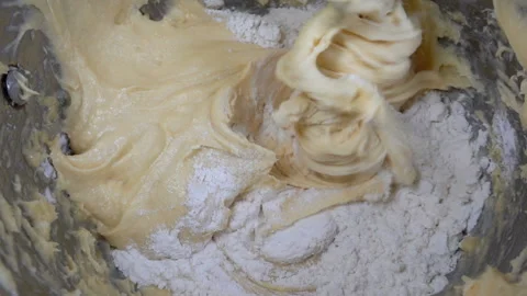 Whipping dough of a food processor in slow motion Stock Footage 145764758