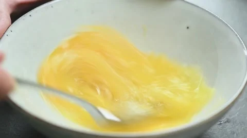 Whipping egg in the bowl. Vídeos de archivo 169800191