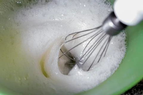  Whipping egg to make meringue. Stock Photos