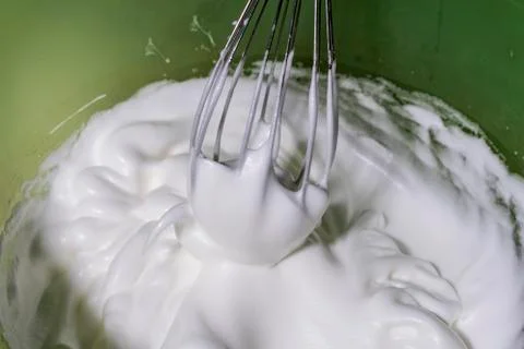  Whipping egg to make meringue. Stock Photos