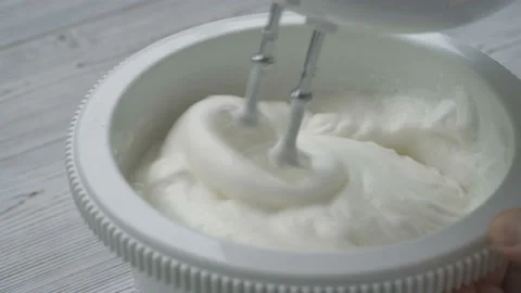 Whipping egg white with a mixer Video stock 128806397