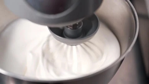 Whipping egg whites for baking. Fluffy base for cakes, cookies, meringue Stock Footage 307710150
