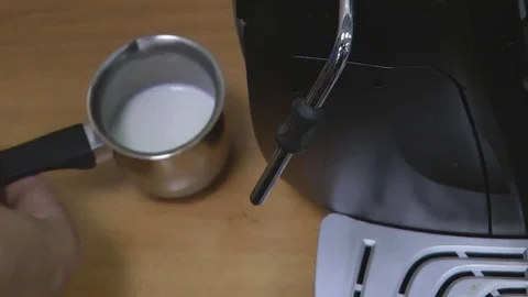 Whipping milk for cappuccino Stock Footage 80233783