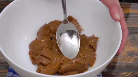 Whips up a cream based on condensed milk Stock Footage 155298630