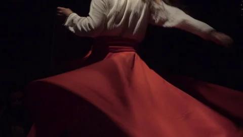 Whirling Dervish performing Sufi dance in the spotlight Stock Footage 336302976