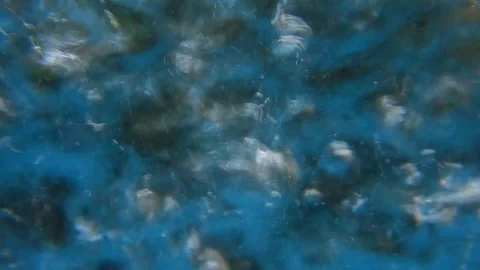 Whirlwind of bubbles and bubbling in a dark blue liquid Stock Footage 109289739