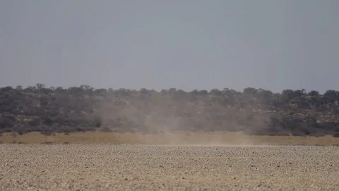 Whirlwind tornado moving through salt pan in Kalahari Botswana Video stock 114266482