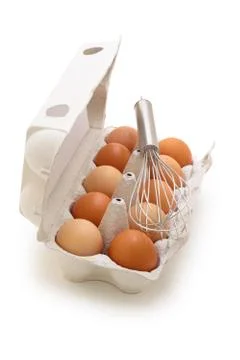 Whisk and eggs. Stock Photos