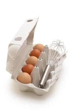 Whisk and eggs. Stock Photos