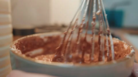 Whisk blending batter. Chef preparing chocolate mixture. Baker mixing cocoa and Stock Footage 342335893
