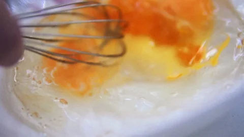 Whisk the eggs with a whisk 스톡 동영상 86134336