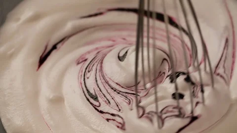 Whisk is mixing blackberry cherry jam in white Cream Close up Stock Footage 103041677