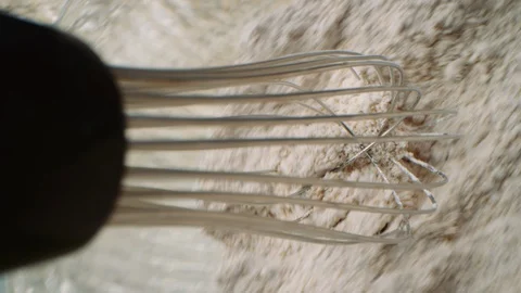 Whisk perspective stirring flour dry ingredients mixture in mixing bowl 스톡 동영상 129292136