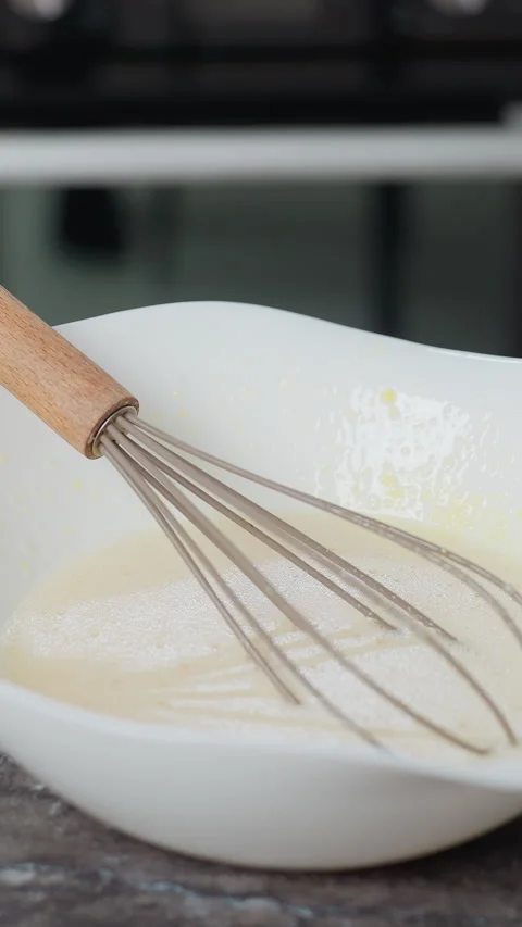 Whisk Resting in Baking Mixture on Kitchen Countertop Stock Footage 320339309