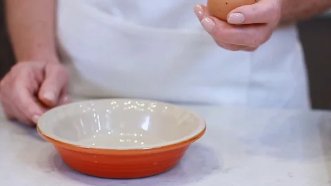 Whisk Scrambled eggs stirred or beaten together pan while being gently heated Stock Footage 77079652