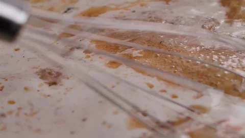A whisk stirs the ingridient of bechamel Stock Footage 295656090