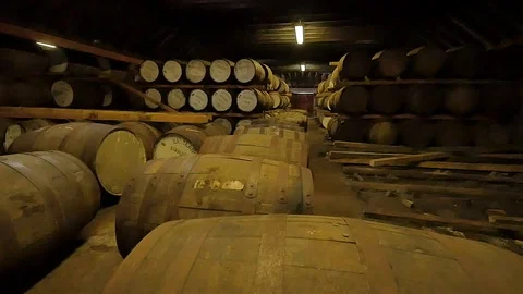 Whiskey Aging Room with Multiple Barrels in a Scottish Distillery Shot in Cellar 動画素材 97616038