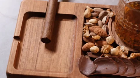 Whiskey and cigar presentation, with some appetizers and nuts, fa01 Stock Footage 277907551