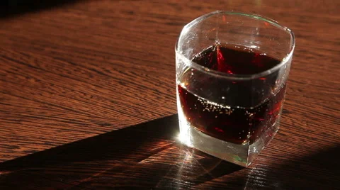 Whiskey and cola is on the table - the man's hand taking a glass  HD Stock Footage 62982317