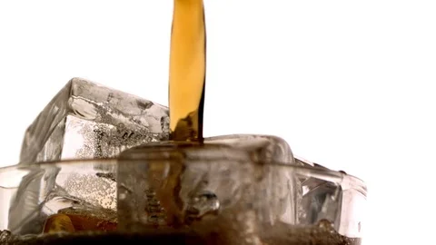 Whiskey being poured on the ice cubes in slow motion Stock Footage 81231144