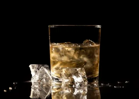 Whiskey on black background Stock Photos