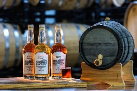 Whiskey bottles back lite in a cellar Stock Photos
