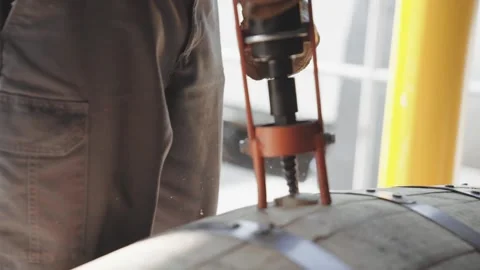 Whiskey Bourbon Barrels Being Dumped and Poured  Stock Footage 240028224