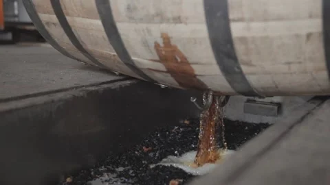 Whiskey Bourbon Barrels Being Dumped and Poured  Stock Footage 240028229