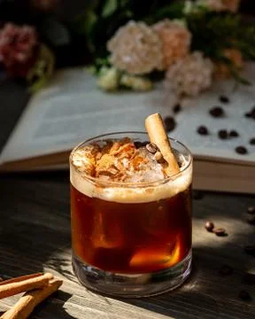 Whiskey with cinnamon on the table Stock Photos