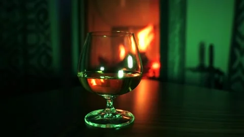 Whiskey by the fireplace. Video stock 168284226