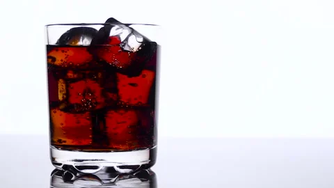 Whiskey in a glass with ice cubes Stock-Footage 101307974