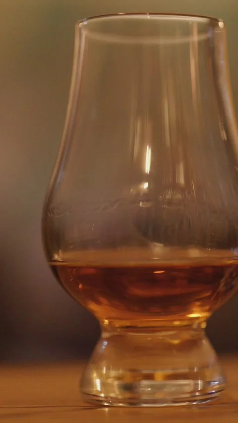 Whiskey Glass Slowly Joined by Second Glass on Bar 스톡 동영상 315086336