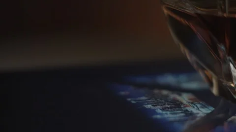 Whiskey in a glass on a table Stock Footage 90755336