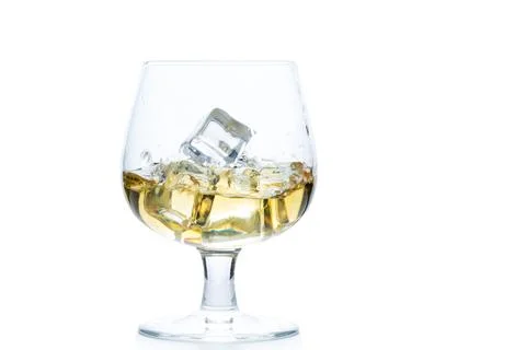 Whiskey or brandy with ice in Snifter or Balloon glass isolated on white ba.. Stock Photos