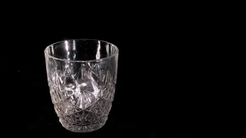 Whiskey poured into a glass Stock Footage 105755311