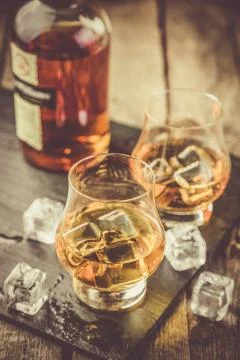 Whiskey on rustic wood background Stock Photos