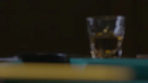 WHISKEY SITS ON POOL TABLE IN SLOW MOTION Video stock 110810525
