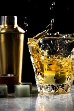 Whiskey splash dynamic drops at high speed Stock Photos