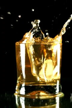 Whiskey splash Stock Photos