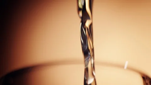 Whiskey stream pouring macro close up Slow Motion Stock Footage 114011959