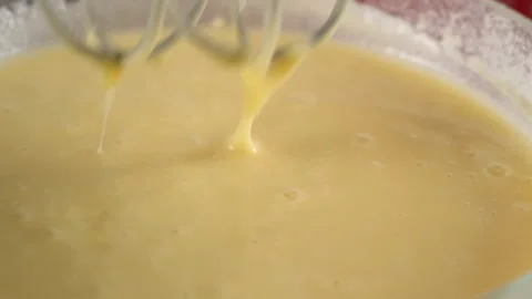 Whisking batter: creating smooth consistency for baking cake biscuit. Stock Footage 311528384