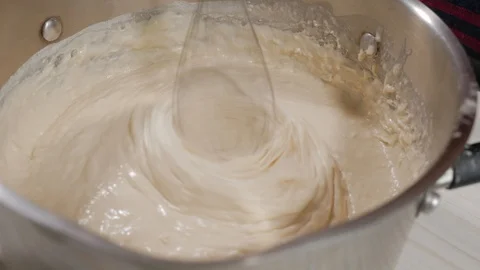 Whisking the batter with a mixer, close up Stock Footage 128667345