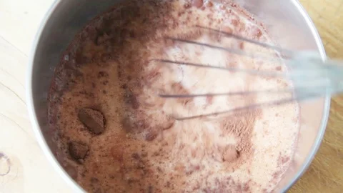 Whisking cocoa with milk Stock Footage 99428847