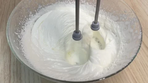 Whisking Cream into Fluffy Peaks Stock Footage 257588681